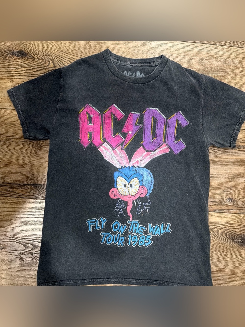 AC/DC Black Tee with Pink & Purple Logo and Blue Cartoon Fly
